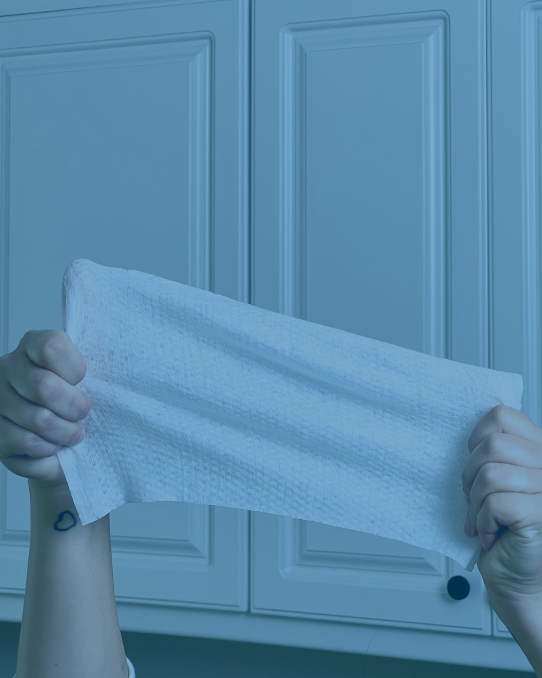 Person holding a disinfecting wipe in 